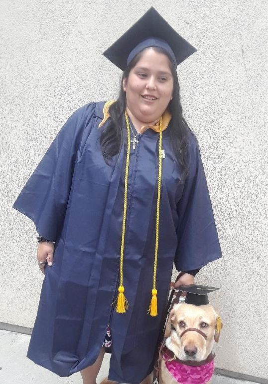 Valerie pictured with her guide dog at her graduation