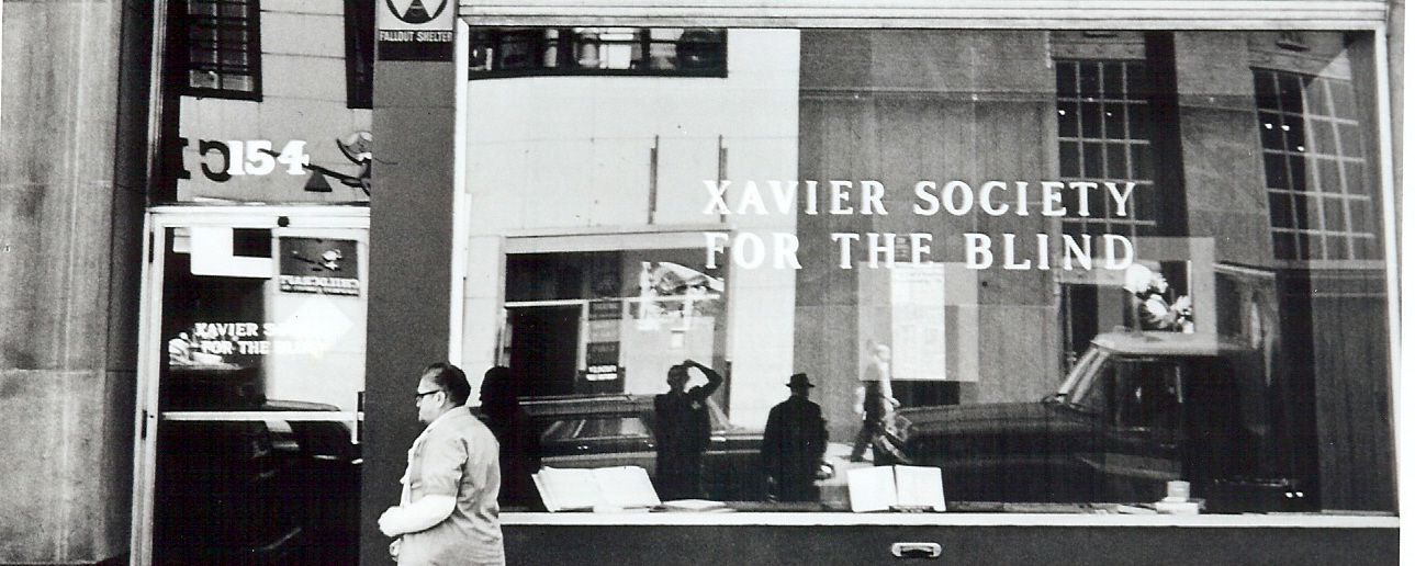 A person walking down the street in front of our old building