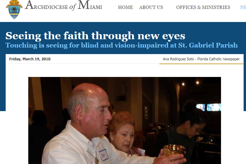 A man holding a chalice as another parishioner looks on